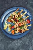 Tasty seafood kebabs, shellfish. photo