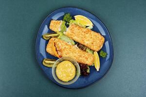 Fried pollock fillets with breadcrumbs photo