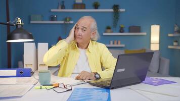 Home office worker man looks at camera with happy and smiling face. video