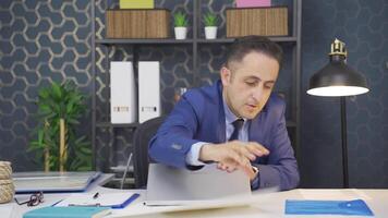 Businessman looking for documents at the table. video