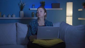 Woman getting tired while using computer at night. video