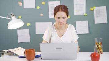 Woman looking at laptop gets frustrated. video