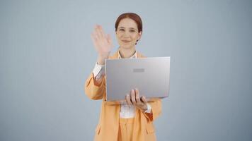 Business woman waving at camera. video