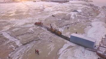 Aerial view of the unloading barge process. Clip. Transporting large container from the cargo ship with a tractor. video
