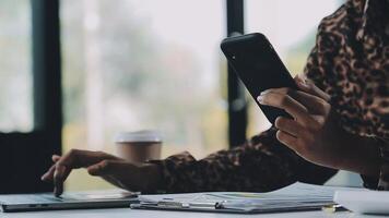 Asian woman holding smartphone, businesswoman using smartphone for social media and messaging with friends, using smartphone to send work email. Concepts of communication via the internet. video