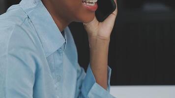 Asian woman holding smartphone, businesswoman using smartphone for social media and messaging with friends, using smartphone to send work email. Concepts of communication via the internet. video