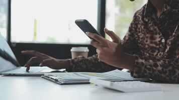 Asian woman holding smartphone, businesswoman using smartphone for social media and messaging with friends, using smartphone to send work email. Concepts of communication via the internet. video