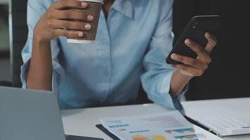 Asian woman holding smartphone, businesswoman using smartphone for social media and messaging with friends, using smartphone to send work email. Concepts of communication via the internet. video