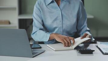 Asian woman holding smartphone, businesswoman using smartphone for social media and messaging with friends, using smartphone to send work email. Concepts of communication via the internet. video