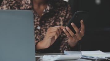 Asian woman holding smartphone, businesswoman using smartphone for social media and messaging with friends, using smartphone to send work email. Concepts of communication via the internet. video
