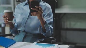 Asian woman holding smartphone, businesswoman using smartphone for social media and messaging with friends, using smartphone to send work email. Concepts of communication via the internet. video