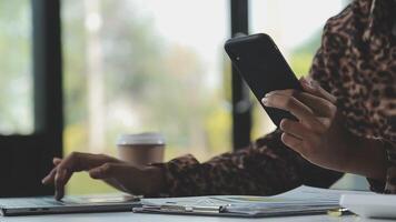 Asian woman holding smartphone, businesswoman using smartphone for social media and messaging with friends, using smartphone to send work email. Concepts of communication via the internet. video