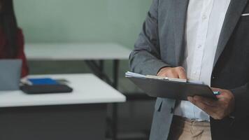 Finance manager meeting discussing company growth project success financial statistics, professional investor working start up project for strategy plan with document, laptop and digital tablet. video