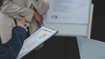 Finance manager meeting discussing company growth project success financial statistics, professional investor working start up project for strategy plan with document, laptop and digital tablet. video