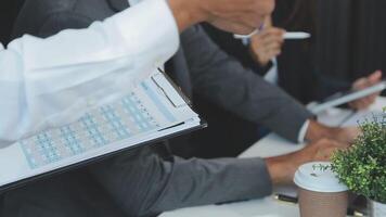 Finance manager meeting discussing company growth project success financial statistics, professional investor working start up project for strategy plan with document, laptop and digital tablet. video