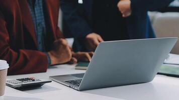 Financial analysts analyze business financial reports on a digital tablet planning investment project during a discussion at a meeting of corporate showing the results of their successful teamwork. video