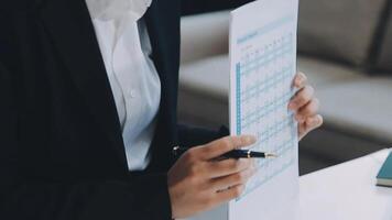 Young architect work project. Photo woman working with new startup project in modern loft. Generic design notebook on wood table. Horizontal, film effect video