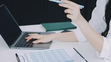 Young architect work project. Photo woman working with new startup project in modern loft. Generic design notebook on wood table. Horizontal, film effect video