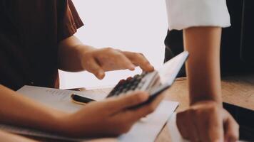 Financial analysts analyze business financial reports on a digital tablet planning investment project during a discussion at a meeting of corporate showing the results of their successful teamwork. video