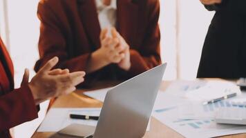 Financial analysts analyze business financial reports on a digital tablet planning investment project during a discussion at a meeting of corporate showing the results of their successful teamwork. video