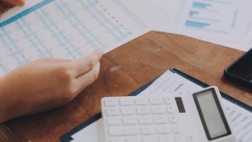 Financial analysts analyze business financial reports on a digital tablet planning investment project during a discussion at a meeting of corporate showing the results of their successful teamwork. video