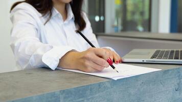 Woman reception consultant working with documents video