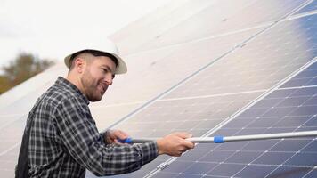 Cleaning solar panels with brush and water video