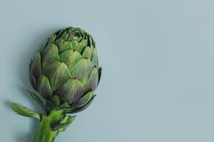 Fresh Artichoke on a grey background. photo