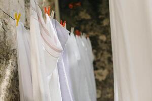 Freshly washed laundry hanging on the street in Dubrovnik old town, Croatia. photo