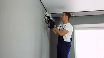 Professional technician installs or maintaining modern air conditioner indoors video