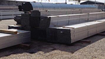 Metal pipes made of rectangular profile in a commercial warehouse video