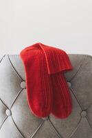 Hand knitted socks on a grey background. Concept for handmade and hygge slow life. photo