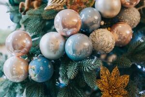 Spruce branches with Christmas ornaments and lights. photo