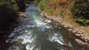 Rafting on a mountain river. Aerial view video