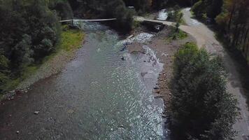 Four sportsman begin River rafting on kayaks. Extreme sport video