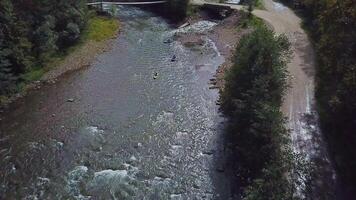 Rafting on a mountain river. Aerial view video