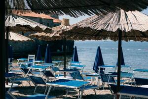 Empty beach near the old town of Budva, Montenegro. Beautiful sunny morning. photo