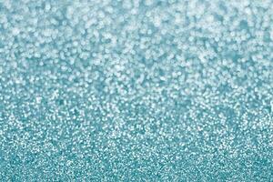 Abstract blue glitter background. Sparkle blue bokeh christmas background. photo