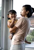 Mother Holding Her Baby Boy photo