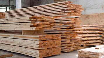 Fresh wooden slabs at the lumber storehouse. Lumber warehouse. Modular prefabricated houses concept video