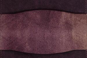 Texture of natural burgundy leather for products. photo