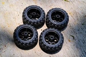 Two pairs of new Toy car rubber tires. Part of RC Remote Control Car. Toys Photography. Hobbies and leisure. Selective Focus. Textured Details. Shot in Macro lens photo