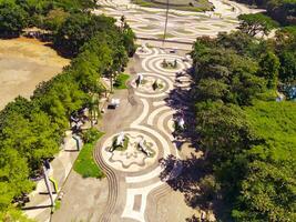 Aerial shot of city park with beautiful floor patterns and trees. Textured Background floor pattern. Aerial photography. Textured details. Shot from a flying drone photo