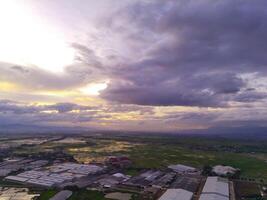 Sunset View. Aerial Photography. Picturesque Panoramic Aerial sky in the afternoon. Shot from a drone flying 200 meters high. Cikancung, Indonesia photo