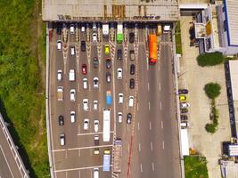 Bird eye view of Vehicle queue at the Purbaleunyi toll gate, due to the surge in travelers during the holiday season, Bandung, West Java Indonesia, Asia. Transportation Industry. Top view. Aerial Shot photo