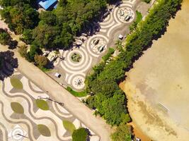 Aerial shot of city park with beautiful floor patterns and trees. Textured Background floor pattern. Aerial photography. Textured details. Shot from a flying drone photo