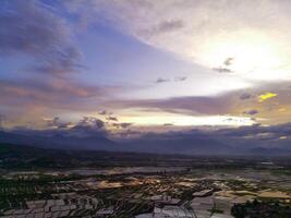 Sunset View. Aerial Photography. Picturesque Panoramic Aerial sky in the afternoon. Shot from a drone flying 200 meters high. Cikancung, Indonesia photo