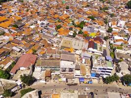 Aerial Landscape of an overpopulated residential district of Bandung city. View of the dense residential landscape in Downton. Aerial photography. Social Issues. Shot from a flying drone photo