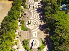 Aerial shot of city park with beautiful floor patterns and trees. Textured Background floor pattern. Aerial photography. Textured details. Shot from a flying drone photo