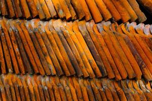 Background Photography. Textured Background. Photo of pile of used roof tiles. Close up photo of a pile of mossy roof tiles. Bandung - Indonesia, Asia